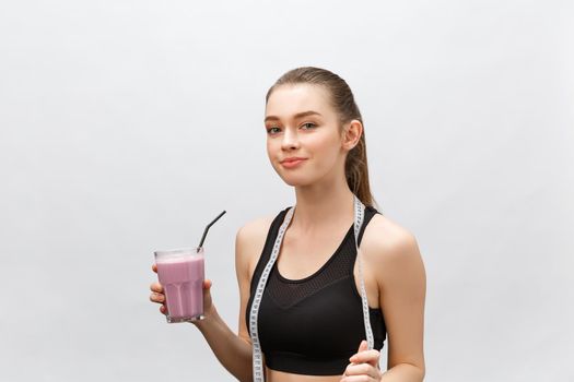 young happy woman with healthy diet shake drinking for sport and fitness.
