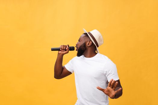 Young teenage black African American boy singer performing at a concert.