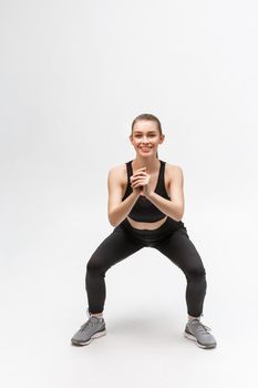 Exercise. Sports Woman In Fashion Sportswear Stretching Legs