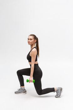 Exercise. Sports Woman In Fashion Sportswear Stretching Legs