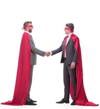 two businessman in superhero capes shake hands