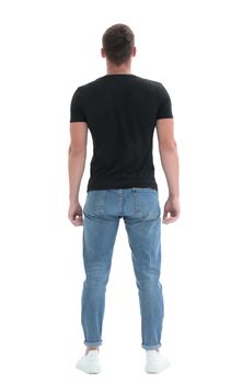 rear view. guy in a black t-shirt staring at a white wall
