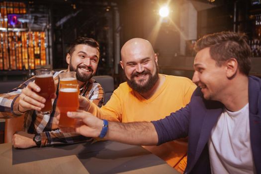 Group of friends drinking beer together