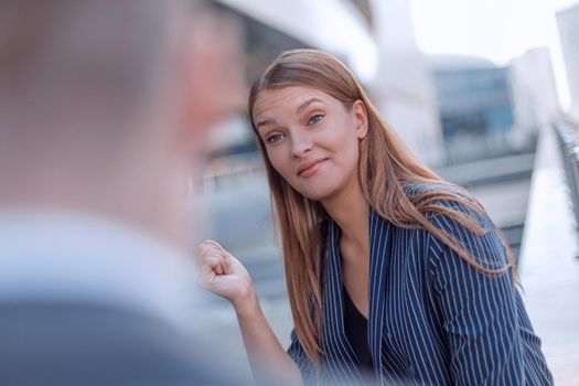 serious young woman asking something of her interlocutor
