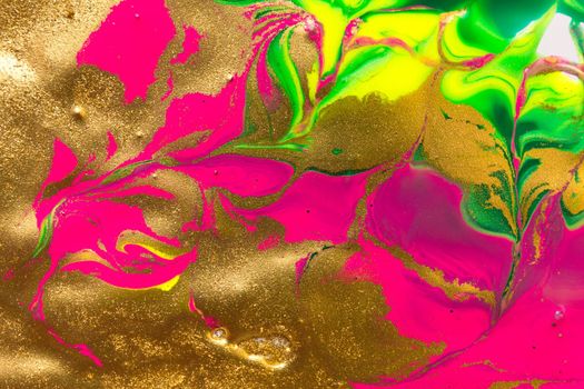 Gold foil abstract background with fluorescent pink parts