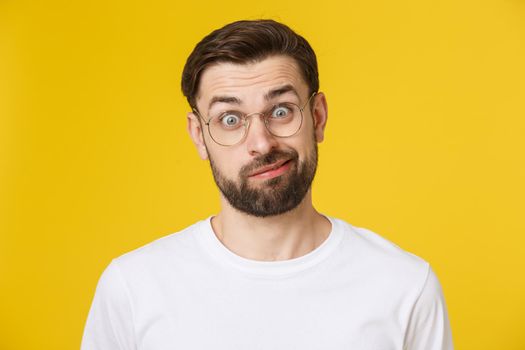 Young casual man portrait isolated on yellow background