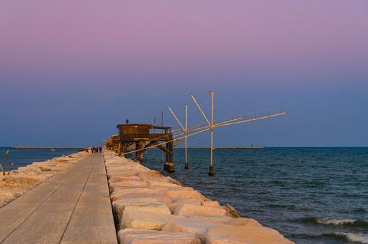 Traditional fishing stations houses with fishnet in water of Adriatic sea