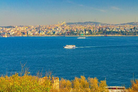 Cityscape of Istanbul city historical centre with ship boat sailing water of Bosporus Bosphorus Strait of Istanbul
