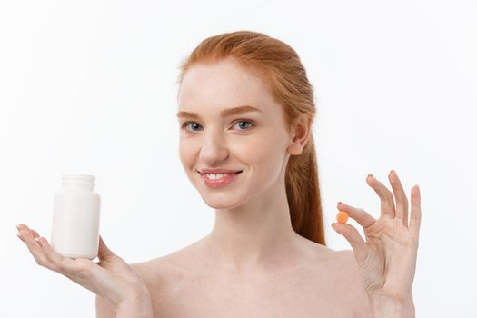 Beautiful Smiling Girl Taking Medication, Holding Bottle With Pills. Healthy Happy Female Eating Pill. Vitamins And Supplements,Diet Nutrition Concept