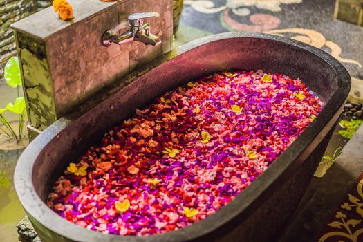 Spa petals in bowl with tropical flowers, spa pedicure treatment