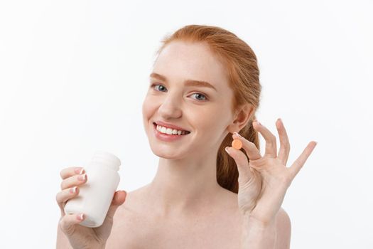 Beautiful Smiling Girl Taking Medication, Holding Bottle With Pills. Healthy Happy Female Eating Pill. Vitamins And Supplements,Diet Nutrition Concept