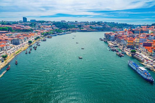 Aerial panoramic view of Porto Oporto city historical centre with Douro River with boats