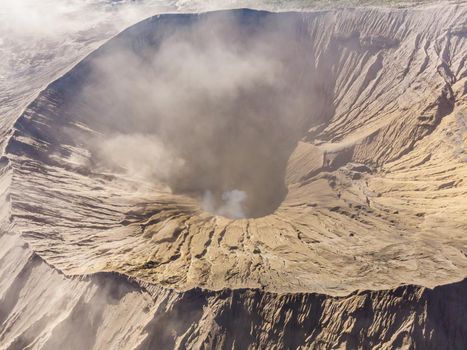 Aerial view on the crater of the Bromo volcano at the Bromo Tengger Semeru National Park on Java Island, Indonesia. One of the most famous volcanic objects in the world. Travel to Indonesia concept