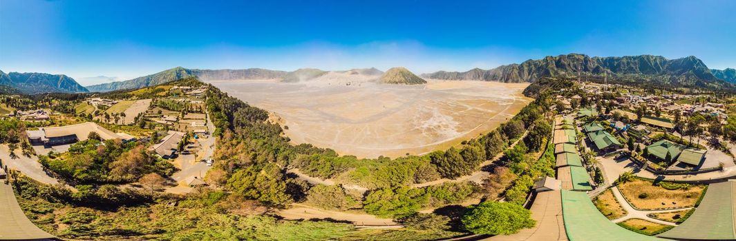 Panoramic Aerial shot of the Bromo volcano and Batok volcano at the Bromo Tengger Semeru National Park on Java Island, Indonesia. One of the most famous volcanic objects in the world. Travel to Indonesia concept