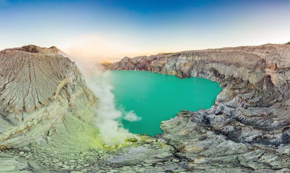 Aerial shot of the Ijen volcano or Kawah Ijen on the Indonesian language. Famous volcano containing the biggest in the world acid lake and sulfur mining spot at the place where volcanic gasses come from the volcano