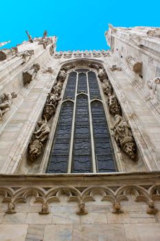 Milan cathedral exterior window blue sky