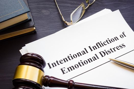 Papers about intentional infliction of emotional distress IIED and gavel.