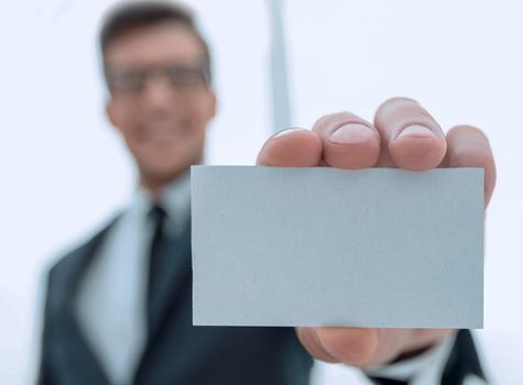 businessman showing a blank business card.business concept