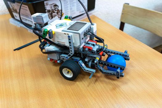 programmable children's robot assembled from designer parts