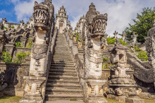 Three stone ladders in beautiful Pura Lempuyang Luhur temple. Summer landscape with stairs to temple. Paduraksa portals marking entrance to middle sanctum jaba tengah of Pura Penataran Agung, Bali