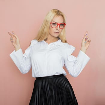Woman in white blouse wearing red glasses