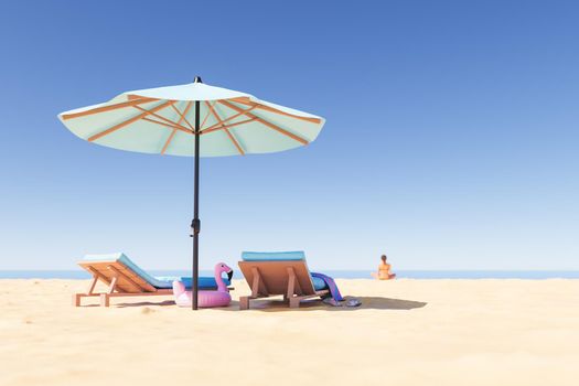 Loungers and parasol on sandy beach