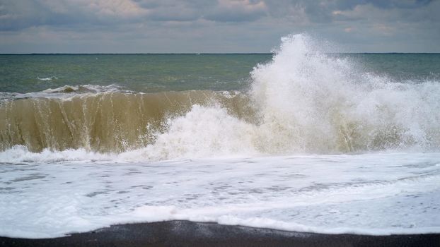 Large sea wave. The sea is stormy. Cold stormy Black Sea coast, Georgia.