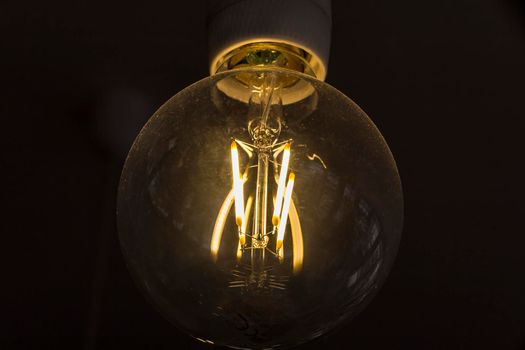 art of lighting of incandescent bulb. Close