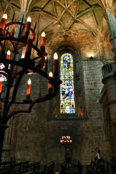 Arches stained glass windows and monumental columns of Santa Maria de Belem church
