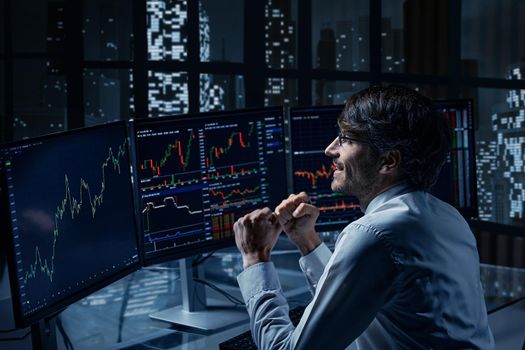 trader-investor is watching the price movement on the screen with emotions