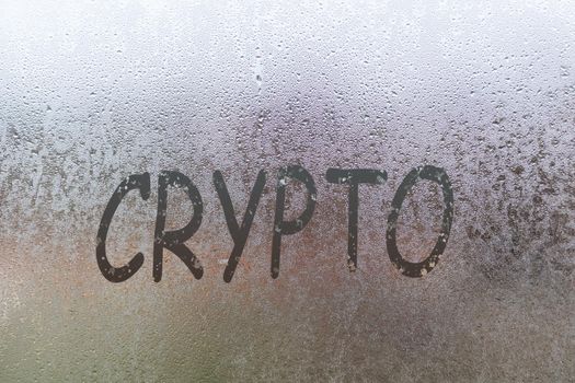 crypto handwritten on wet glass of night window