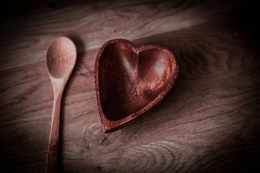closeup. empty wooden salad bowl and wooden paddle