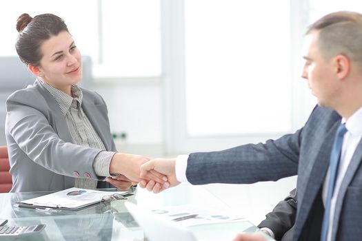 business woman shaking hands with partner at workshop