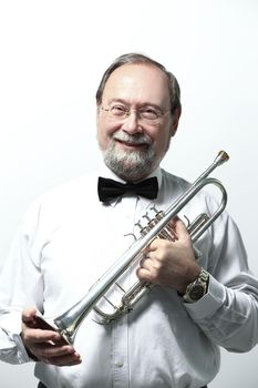 portrait.smiling adult man musician with a trumpet