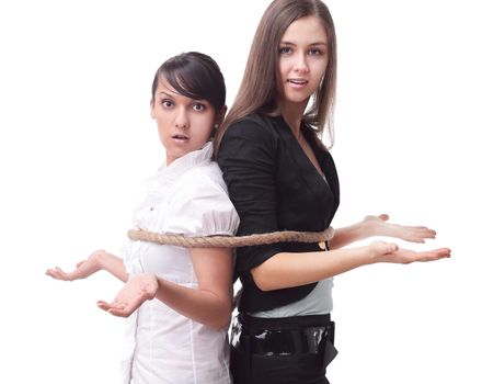 young business partners are bound by rope.the business concept