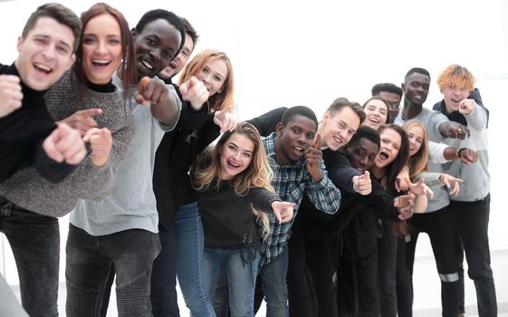 close-up . team of happy young people pointing at you
