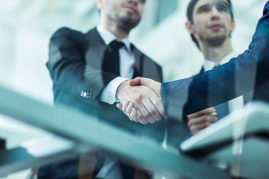 concept of partnership - handshake of business partners