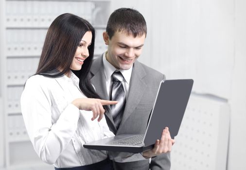 employees communicating on the Internet using laptop.