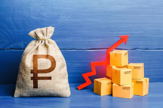 Russian ruble money bag with boxes and up arrow. Good consumer sentiment and demand for goods. Production rise. Growing transportation prices. Income increase, acceleration and growing of economy.
