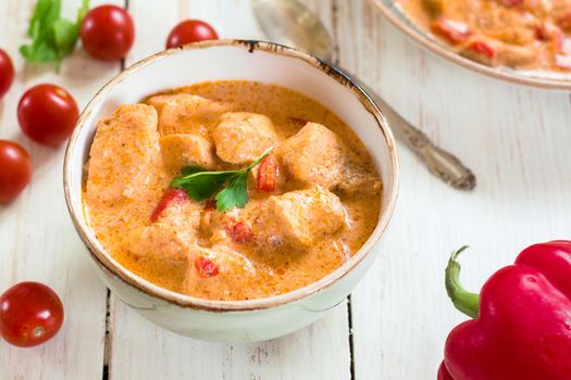 Delicious chicken stew with paprika in a bowl