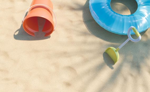 beach toys on sand with palm tree shade