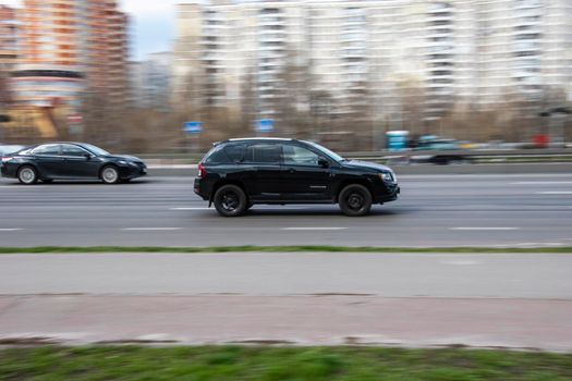Ukraine, Kyiv - 6 April 2021: Black Jeep Compass car moving on the street. Editorial