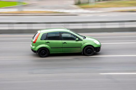 Ukraine, Kyiv - 29 September 2020: Green Ford Fiesta car moving on the street