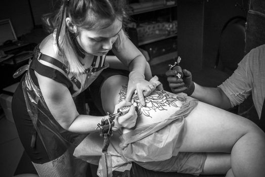Tattooer demonstrates process of making a tattoo tattoo studio