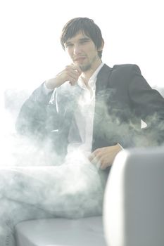 close up.businessman with a cigarette during a coffee break.