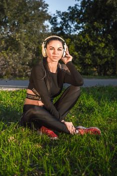 Beautiful sporty girl and headphones listen music and smile