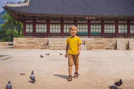 Boy tourist in Korea. Gyeongbokgung Palace grounds in Seoul, South Korea. Travel to Korea concept. Traveling with children concept