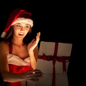 santa woman opening the magical Christmas present box
