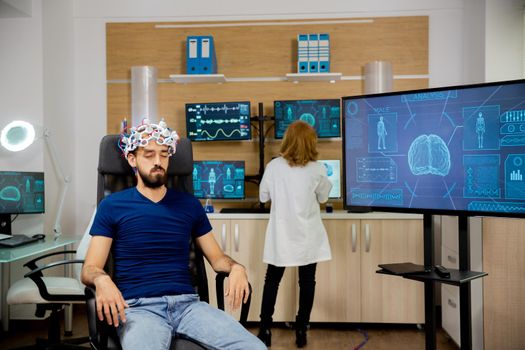 Male patient undergoing a brain scan procedure in the laboratory