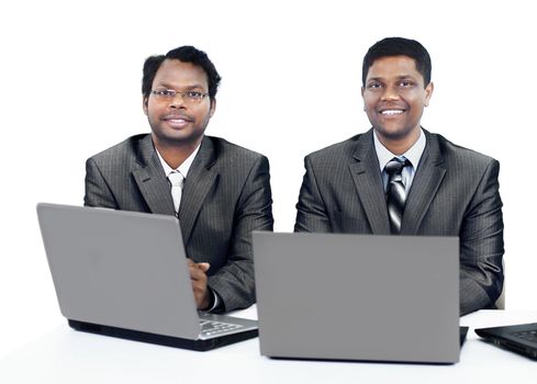 Interracial business team working at laptop